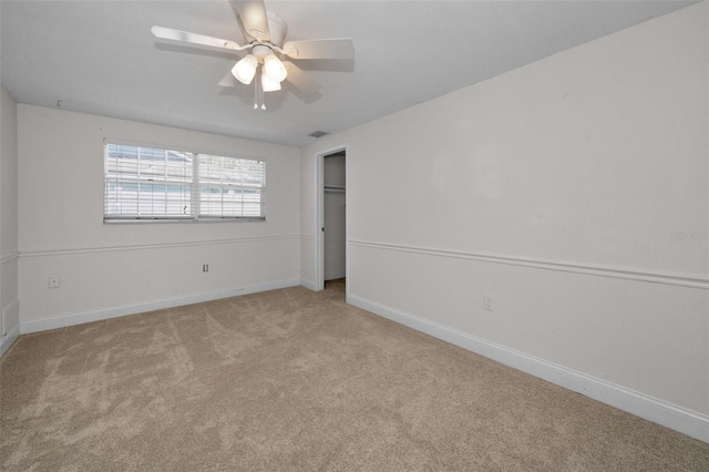 unfurnished bedroom with carpet, baseboards, and a ceiling fan