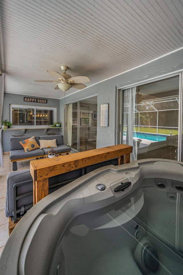 garage with ceiling fan and an outdoor pool