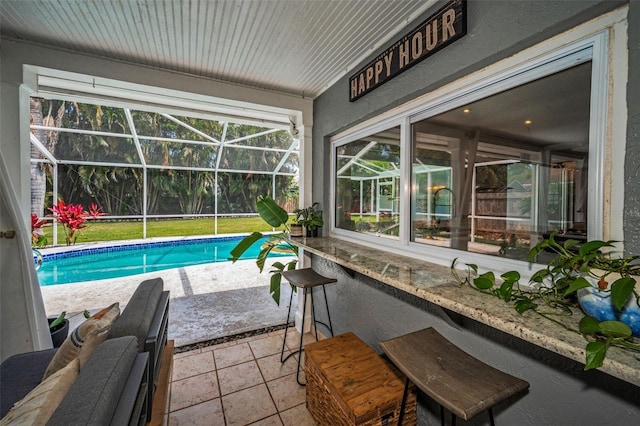 swimming pool with a patio and a lanai
