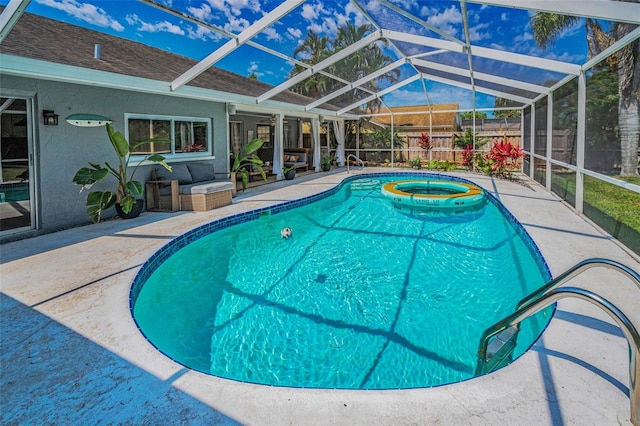 view of pool with a patio, a lanai, fence, and a jacuzzi
