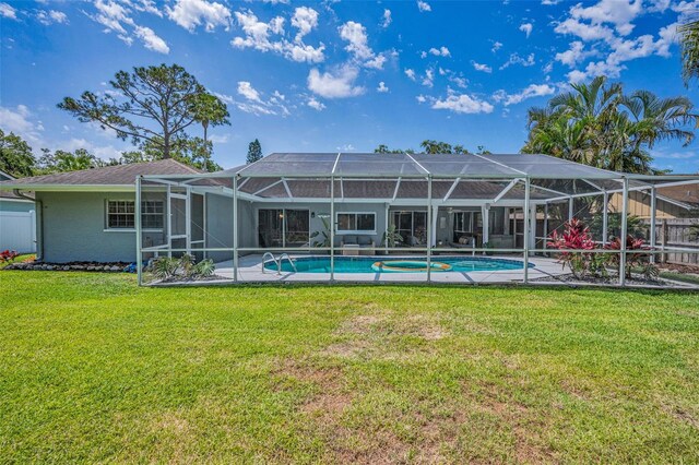 back of house with an outdoor pool, a lanai, and a patio