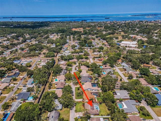 aerial perspective of suburban area with a large body of water