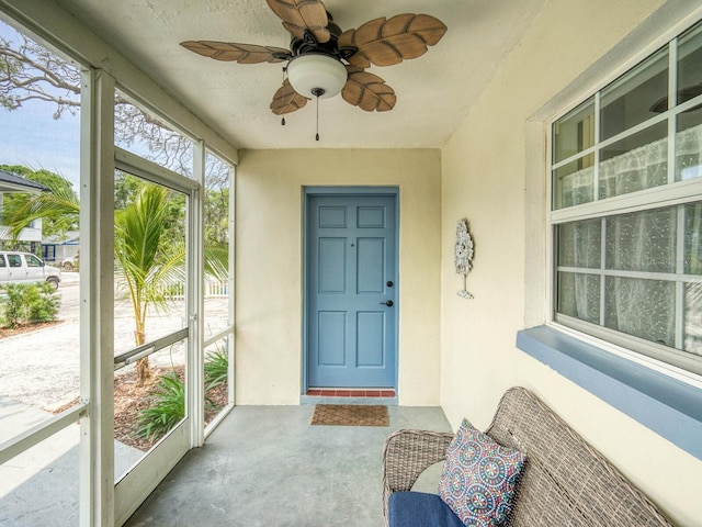 106 E Cedar St, Tarpon Springs, FL 34689 - entrance to property with stucco siding and a ceiling fan