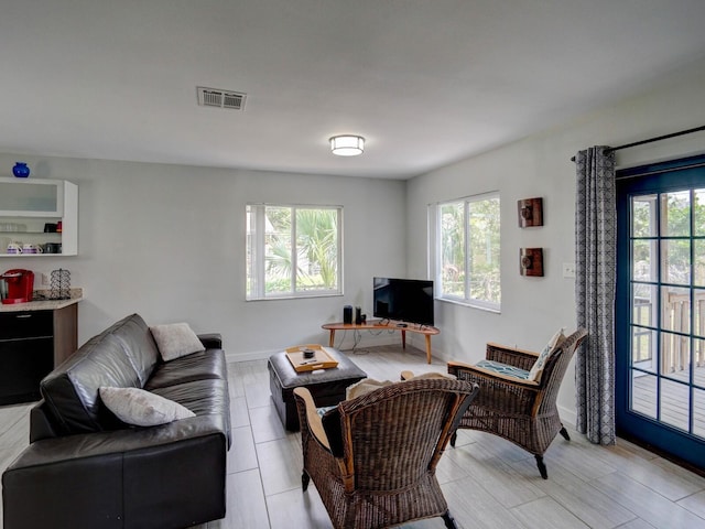 106 E Cedar St, Tarpon Springs, FL 34689 - living room featuring baseboards
