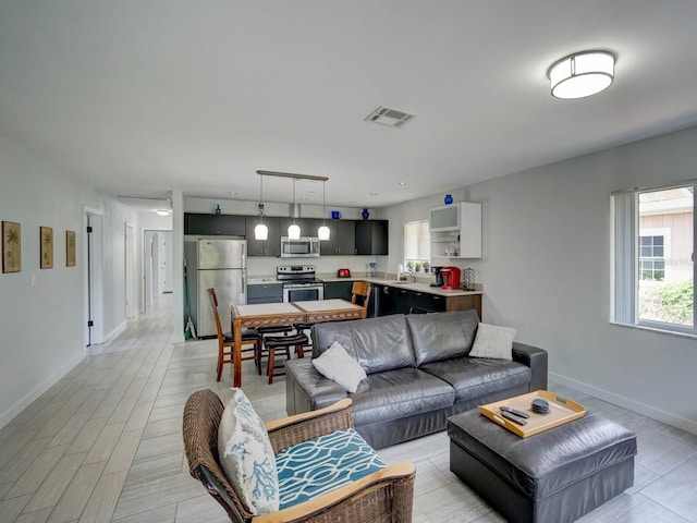 106 E Cedar St, Tarpon Springs, FL 34689 - living room with baseboards