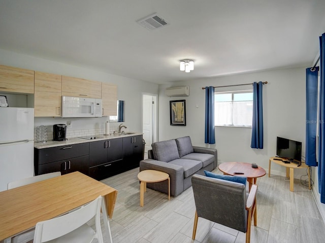 106 E Cedar St, Tarpon Springs, FL 34689 - living area featuring a wall unit AC