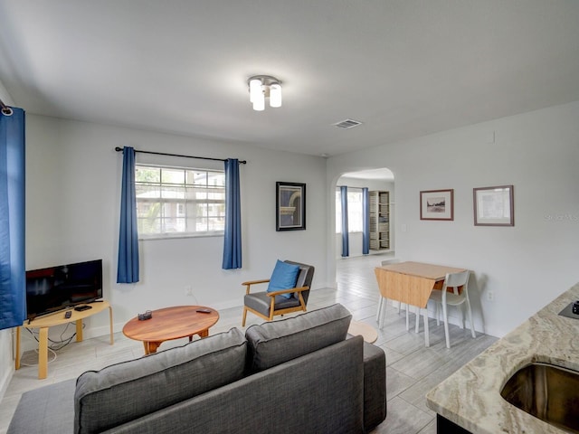 106 E Cedar St, Tarpon Springs, FL 34689 - living area with arched walkways and baseboards
