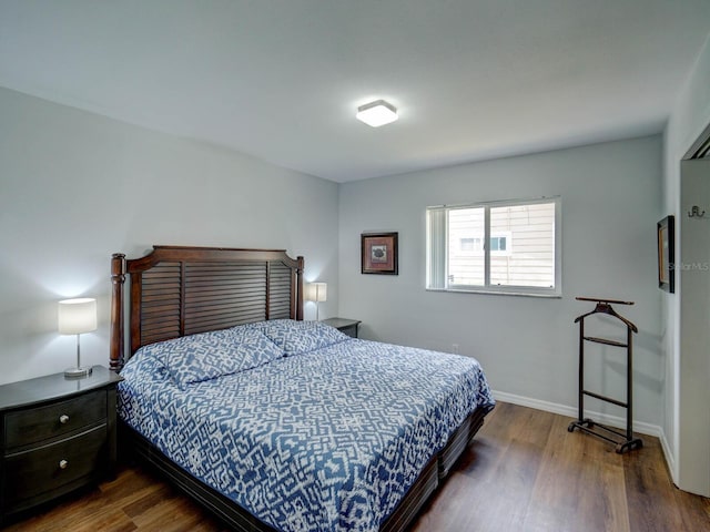 106 E Cedar St, Tarpon Springs, FL 34689 - bedroom featuring wood finished floors and baseboards