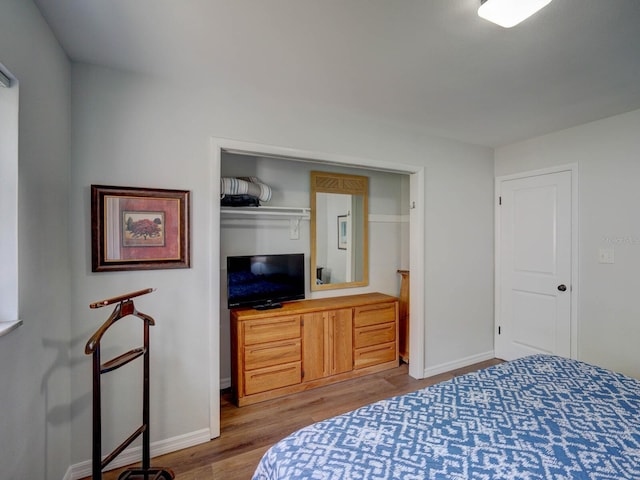 106 E Cedar St, Tarpon Springs, FL 34689 - bedroom featuring wood finished floors and baseboards