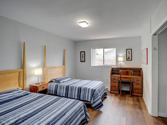 106 E Cedar St, Tarpon Springs, FL 34689 - bedroom featuring wood finished floors and baseboards