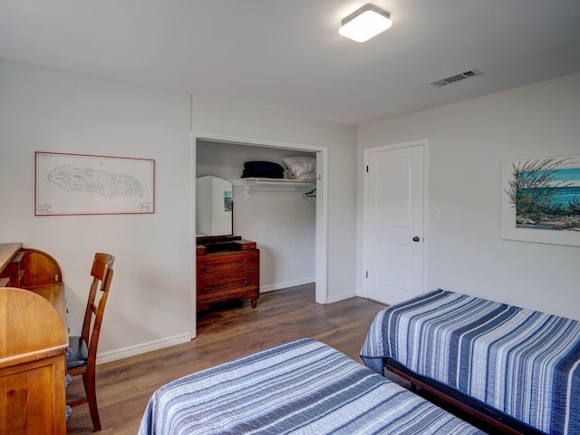 106 E Cedar St, Tarpon Springs, FL 34689 - bedroom featuring wood finished floors, baseboards, and a closet