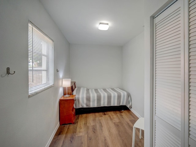 106 E Cedar St, Tarpon Springs, FL 34689 - bedroom featuring baseboards and wood finished floors