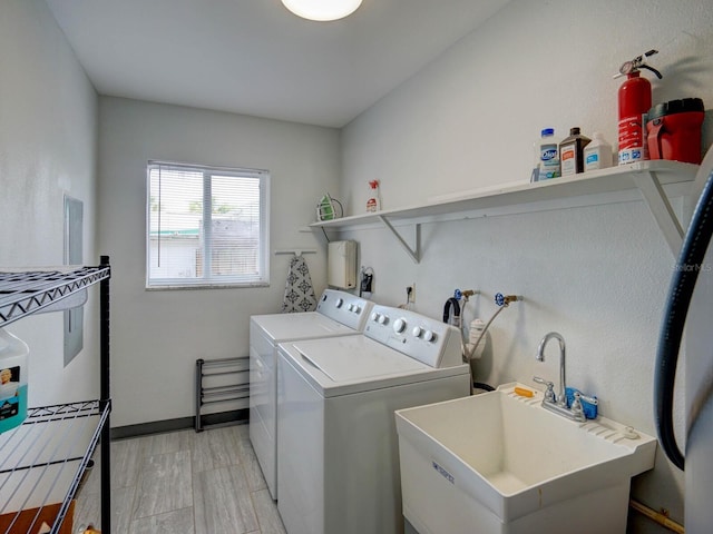 106 E Cedar St, Tarpon Springs, FL 34689 - clothes washing area featuring separate washer and dryer and baseboards