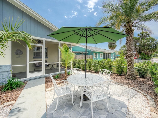 106 E Cedar St, Tarpon Springs, FL 34689 - view of patio with outdoor dining space, fence, and a ceiling fan