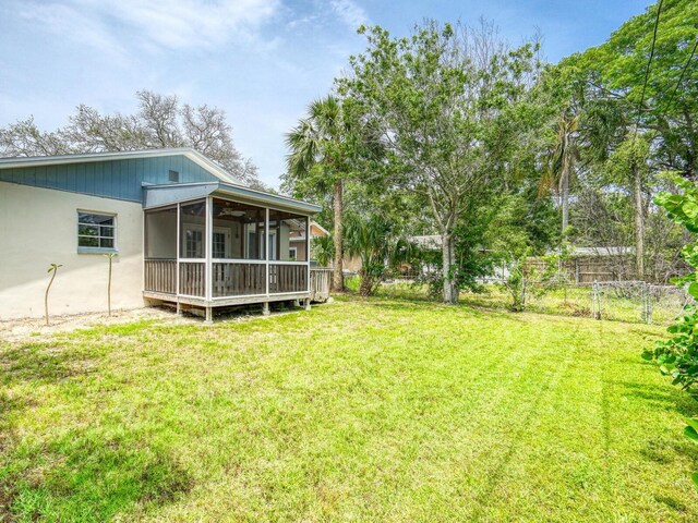 106 E Cedar St, Tarpon Springs, FL 34689 - view of yard featuring a sunroom and a ceiling fan