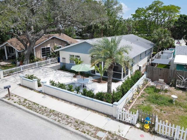 106 E Cedar St, Tarpon Springs, FL 34689 - view of front of house with a fenced backyard