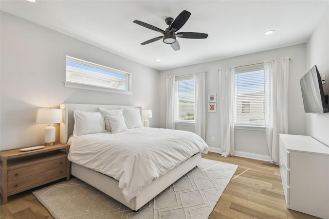 bedroom featuring light wood-style flooring, baseboards, recessed lighting, and a ceiling fan