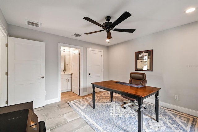 office featuring baseboards, ceiling fan, and recessed lighting