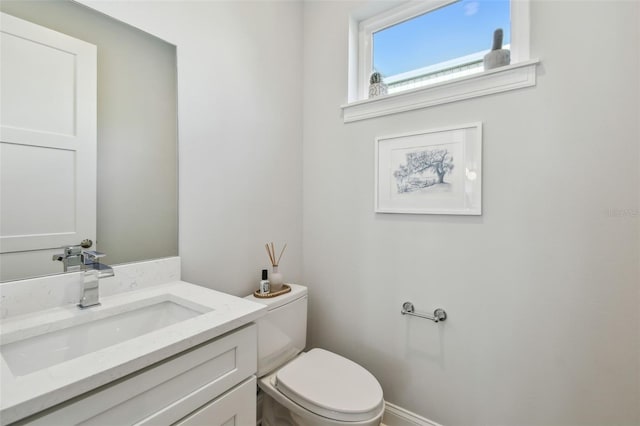 half bath with toilet and vanity
