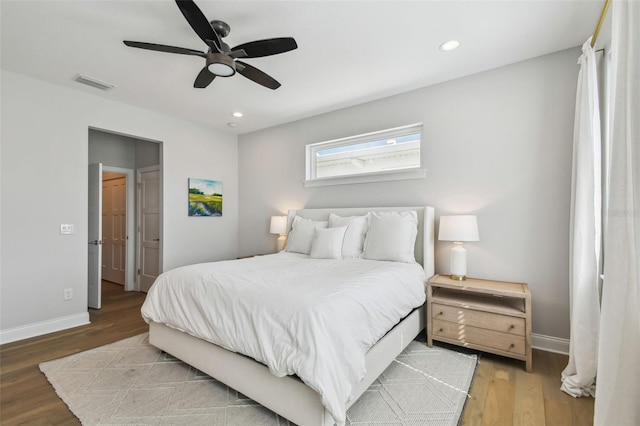 bedroom featuring baseboards, wood finished floors, recessed lighting, and a ceiling fan
