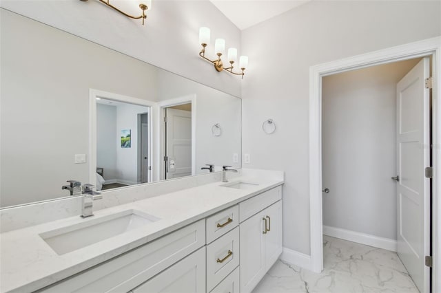full bathroom featuring marble look tiles, double vanity, connected bathroom, and baseboards