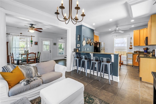 1038 Crescent Lake Dr N, Saint Petersburg, FL 33701 - living area featuring ceiling fan, recessed lighting, crown molding, dark tile patterned floors, and a chandelier