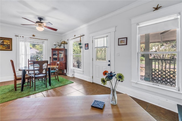 1038 Crescent Lake Dr N, Saint Petersburg, FL 33701 - dining area featuring tile patterned flooring, crown molding, ceiling fan, and baseboards