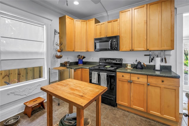 1038 Crescent Lake Dr N, Saint Petersburg, FL 33701 - kitchen with black appliances, dark countertops, tile patterned flooring, and crown molding
