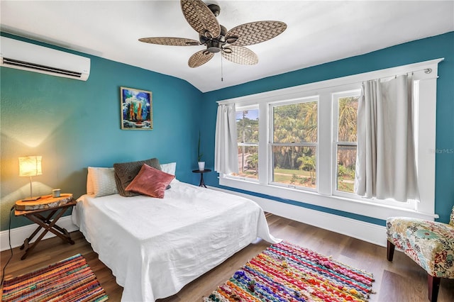 1038 Crescent Lake Dr N, Saint Petersburg, FL 33701 - bedroom featuring a wall mounted AC, baseboards, wood finished floors, lofted ceiling, and a ceiling fan