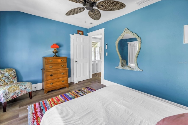 1038 Crescent Lake Dr N, Saint Petersburg, FL 33701 - bedroom featuring wood finished floors, a ceiling fan, and baseboards