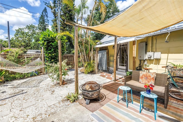 1038 Crescent Lake Dr N, Saint Petersburg, FL 33701 - view of patio / terrace with fence and an outdoor fire pit