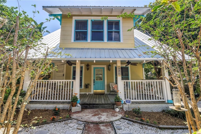 1038 Crescent Lake Dr N, Saint Petersburg, FL 33701 - view of front of house featuring a ceiling fan, a porch, and metal roof