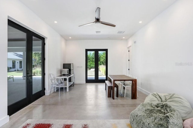 dining space with french doors, concrete flooring, baseboards, recessed lighting, and a ceiling fan