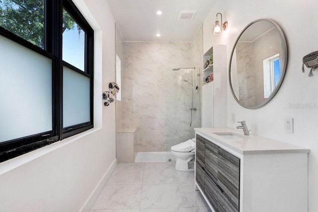 bathroom with marble look tiles, a marble finish shower, recessed lighting, toilet, and vanity
