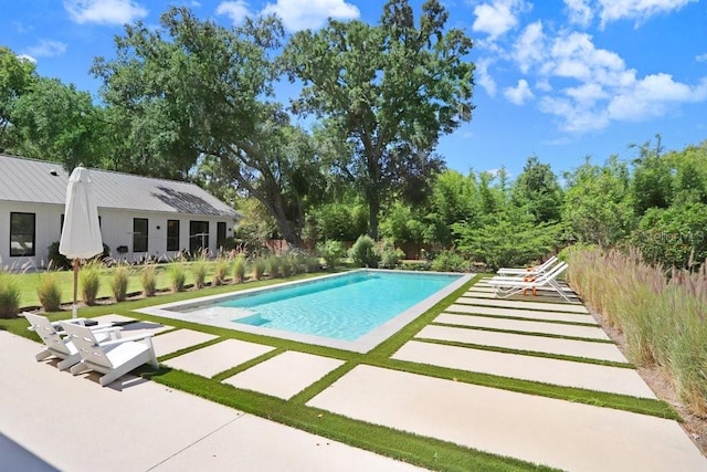 outdoor pool with a patio