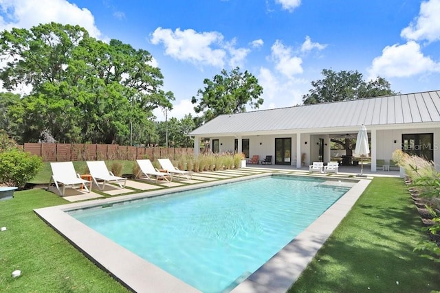 view of swimming pool with french doors, a patio area, and ceiling fan