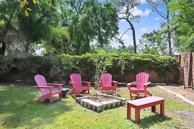 view of yard featuring an outdoor fire pit