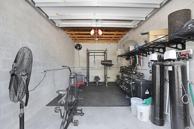 exercise area with concrete block wall