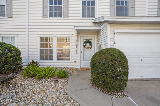 doorway to property featuring a garage