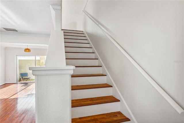 staircase with wood finished floors