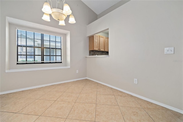 5100 Burchette Rd Unit 3005, Tampa, FL 33647 - empty room with a chandelier, light tile patterned floors, and baseboards