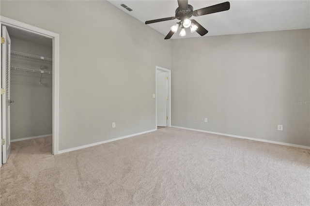 5100 Burchette Rd Unit 3005, Tampa, FL 33647 - unfurnished bedroom with carpet floors, a spacious closet, baseboards, lofted ceiling, and a closet