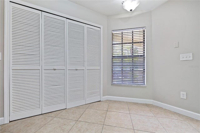 5100 Burchette Rd Unit 3005, Tampa, FL 33647 - unfurnished dining area featuring baseboards and light tile patterned flooring