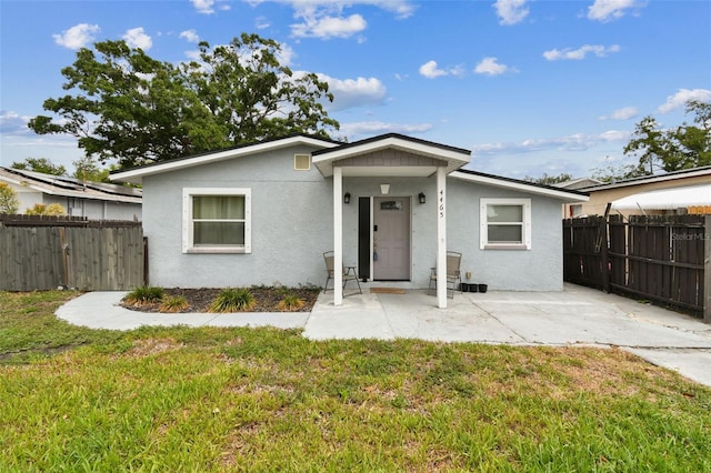 4465 56th Ave N, Saint Petersburg, FL 33714 - view of front facade featuring stucco siding and a patio