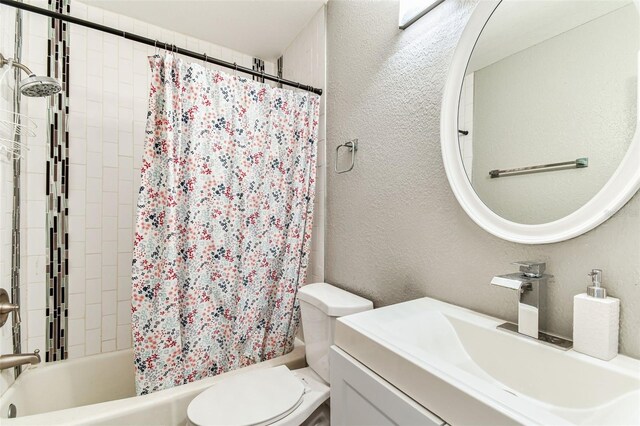 4465 56th Ave N, Saint Petersburg, FL 33714 - full bathroom with a textured wall, vanity, and shower / tub combo