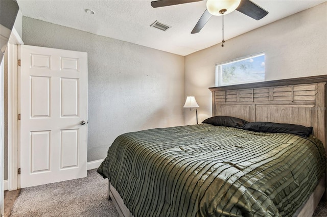 4465 56th Ave N, Saint Petersburg, FL 33714 - carpeted bedroom with a textured wall and ceiling fan