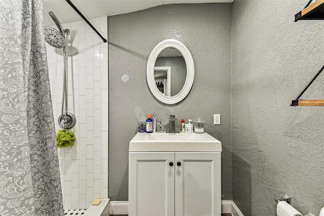4465 56th Ave N, Saint Petersburg, FL 33714 - full bath with tiled shower, vanity, and a textured wall