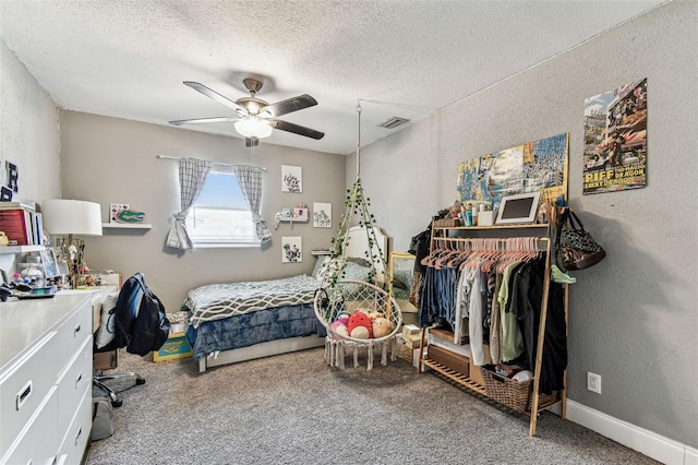 4465 56th Ave N, Saint Petersburg, FL 33714 - bedroom with carpet flooring, a textured ceiling, a textured wall, and ceiling fan