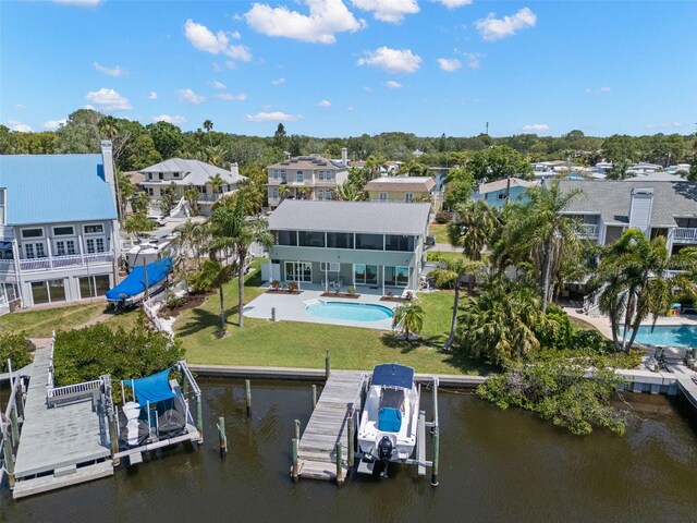261 Kentucky Ave, Crystal Beach, FL 34681 - aerial perspective of suburban area with a pool and a nearby body of water