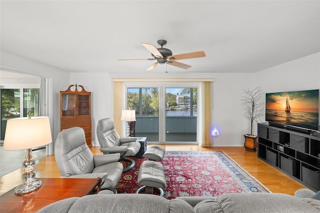 261 Kentucky Ave, Crystal Beach, FL 34681 - living room featuring healthy amount of natural light, ceiling fan, and wood finished floors
